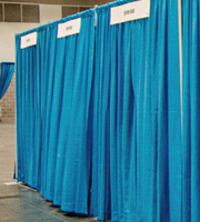 Private interview booths are 8'x8' curtained spaces with three chairs and a 4' table.