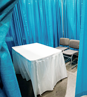 Private interview booths are 8'x8' curtained spaces with three chairs and a 4' table.