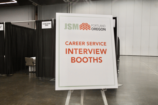 Private interview booths are 8'x8' curtained spaces with three chairs and a 4' table.